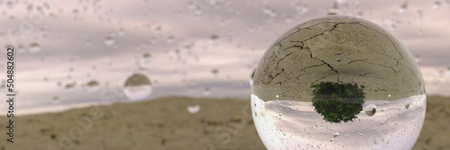 First rainfall water droplets falling onto a cracked dry earth after a drought 3d render