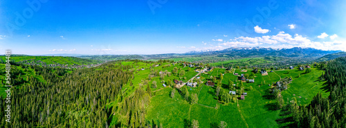 Polskie Podhale wiosną i góry wysokie Tatry, panorama z lotu ptaka.