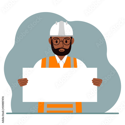 Engineer man holding a blank sheet of paper. The concept of a builder, engineer, planner or designer.