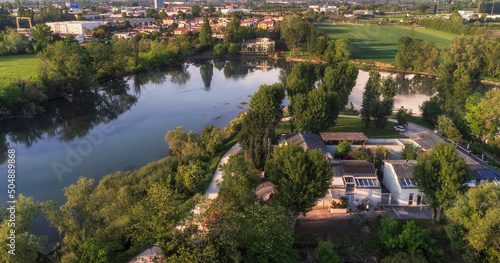 Aerial view of the River Sile and of the "Greenway del Sile" bike and walking trail, on the foreground the "PArCo Foundation",on the background the historical Villa Barbaro bed and breakfast