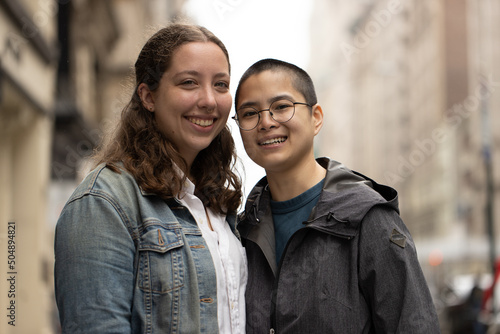 LGBTQ couple on city street © blvdone