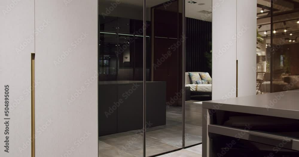 Dressing room with things. Elegant Wooden Built Walk In Closet Decoration. Luxury Dressing Room. Modern Sliding Doors. Black wardrobe with Sliding Black Doors. , Luxury Bedroom With Walk In Closet. Dressing room with things. Elegant Wooden Built Walk In Closet Decoration. Luxury Dressing Room. Modern Sliding Doors. Black wardrobe with Sliding Black Doors. , Luxury Bedroom With Walk In Closet.