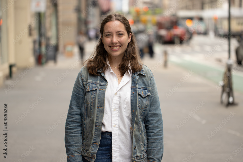 Caucasian woman on a city street portrait smiling happy Caucasian woman on a city street portrait smiling happy