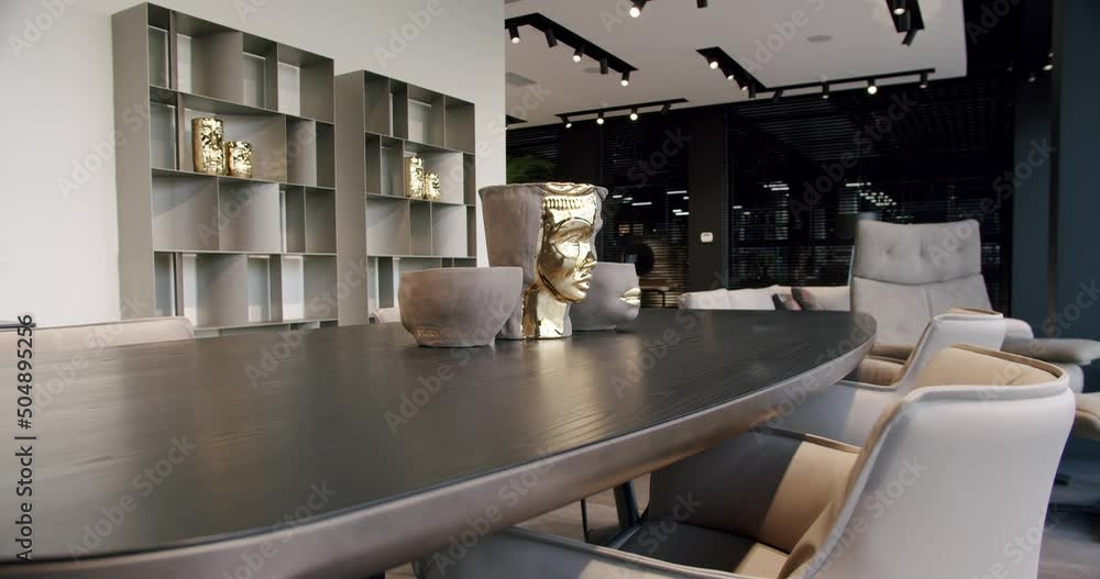 Beautiful kitchen interior with new stylish furniture. Stylish And Contemporary Empty Home. Real estate interior. Dolly shot . Kitchen Dining Room with wooden table and modern leater chairs.