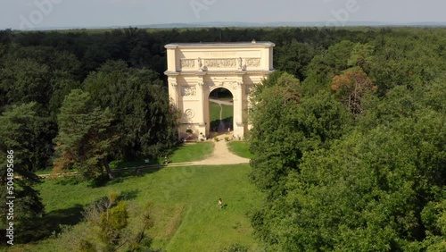 Woman running towards Diana's temple triumphal arch in Moravia, drone. photo