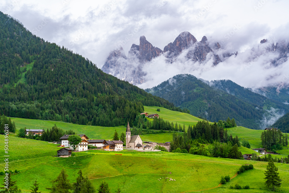Evening view the famous Church of St. Magdalena with Odle Peaks of the Italian Dolomites Mountain in Province of Bolzano, South Tyrol, Italy.
