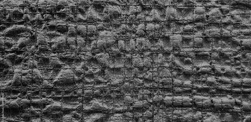The surface of black plastic canvas for background. Abstract and seamless pattern wallpaper. Close up line on nylon. The surface of black plastic canvas for background. Abstract and seamless pattern wallpaper. Close up line on nylon.