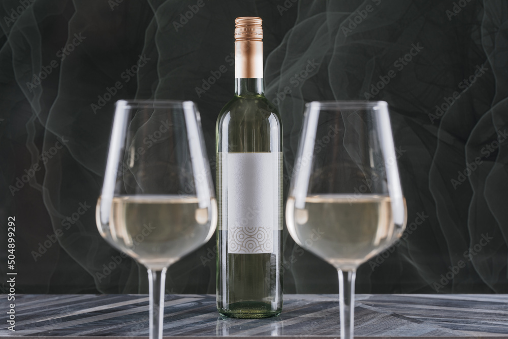 bottle of white wine with a glass bottle of white wine with a glass