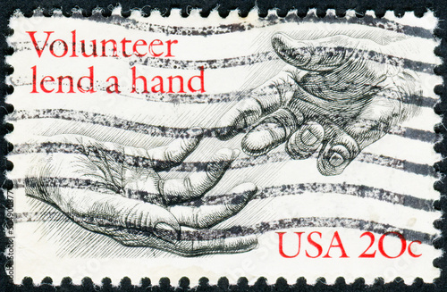 USA - CIRCA 1983: Postage stamp printed in the United States of America shows two hands, Voluntarism photo