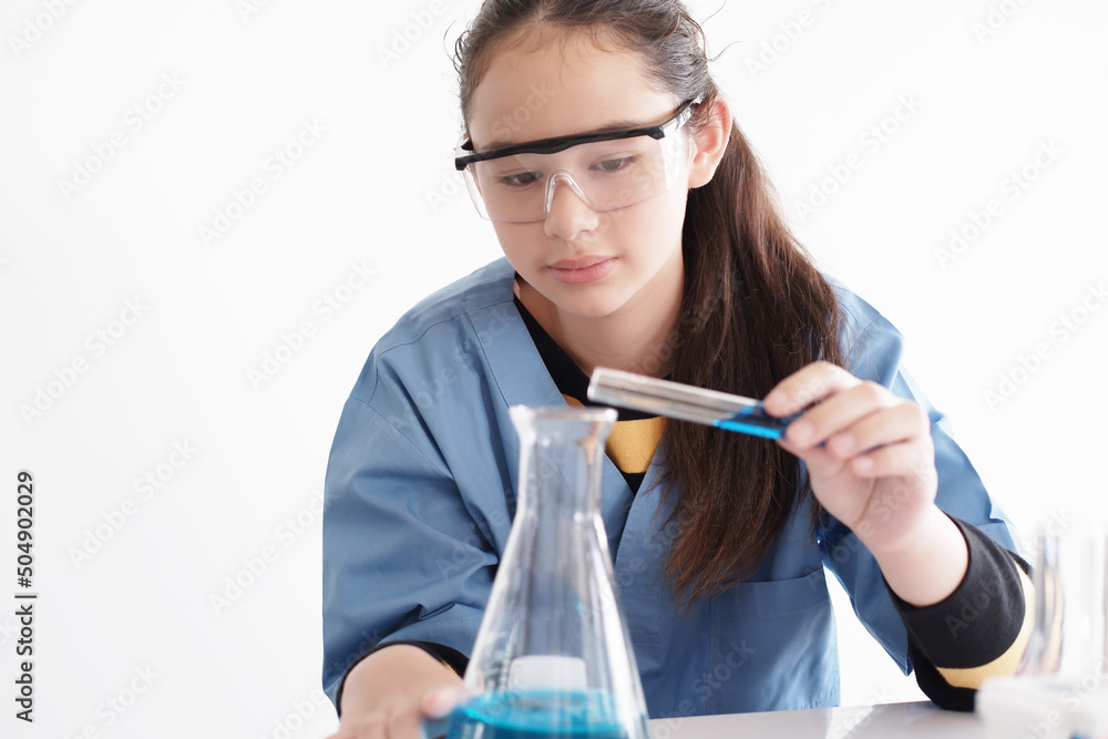 Smiling Caucasian student or pupil girl is study and test for chemical and science. She is experimenting at laboratory Lab of school. Education and knowledge concept. Smiling Caucasian student or pupil girl is study and test for chemical and science. She is experimenting at laboratory Lab of school. Education and knowledge concept.
