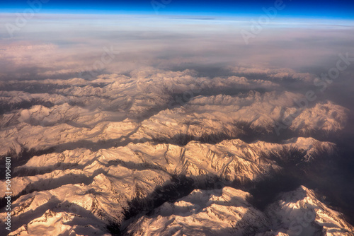 The aerial view of the Alps, peaks covered with snow
