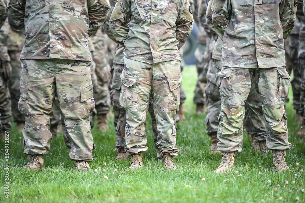 Detail shot with american soldiers in military standing position during ceremony