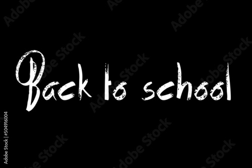 Back To School - scritta con il gesso su lavagna nera - sfondo nero con scritta bianca Ritorno a Scuola photo