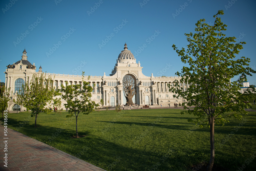 Architecture of Kazan. The Palace of Farmers, a landmark with a large tree.