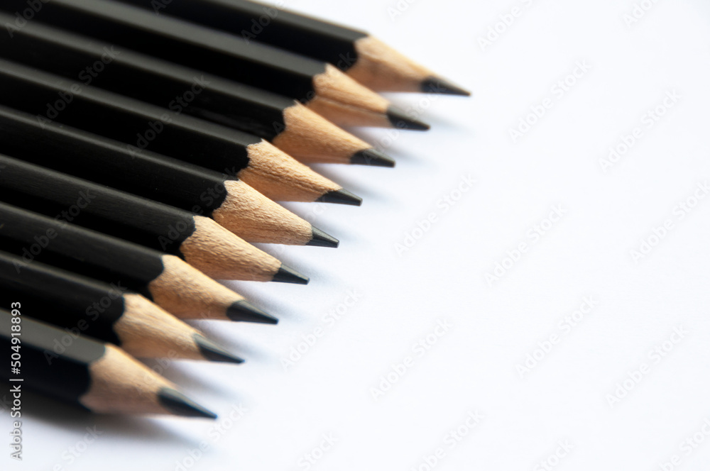 Wooden pencil on white background. Copy space and educational concept Wooden pencil on white background. Copy space and educational concept