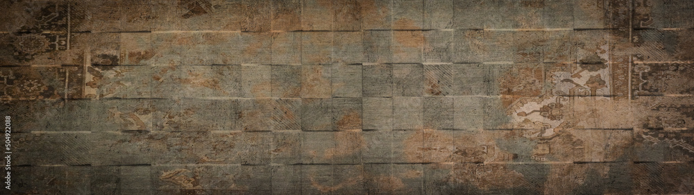 Fototapeta premium Old brown gray rusty vintage worn shabby patchwork square motif tiles stone concrete cement wall texture background banner panorama.