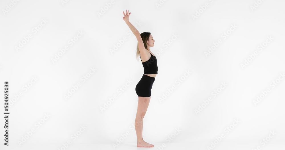 Blonde woman doing yoga exercise in studio closeup