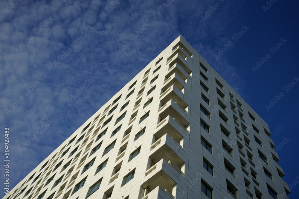 A building under blue sky with clouds