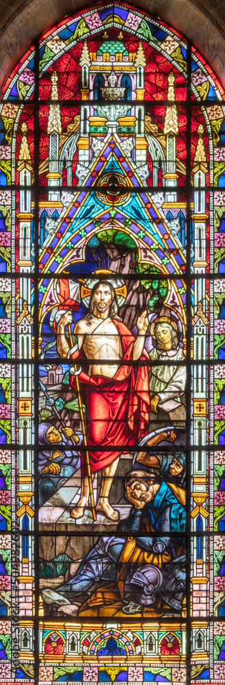 VALENCIA, SPAIN - FEBRUAR 17, 2022: The Resurrection in neo-gothic stained glass of  church Basilica de San Vicente Ferrer by Talleres Maumejean Hermanos from 20. cent.