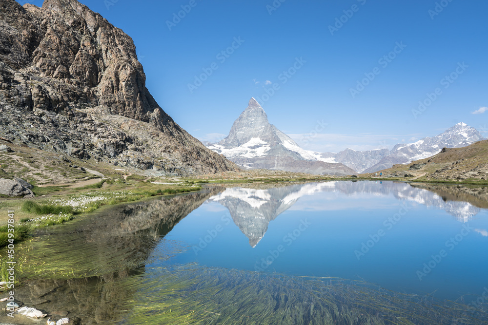 Matterhorn reflection in Riffelsee, Zermatt, Switzerland Matterhorn reflection in Riffelsee, Zermatt, Switzerland