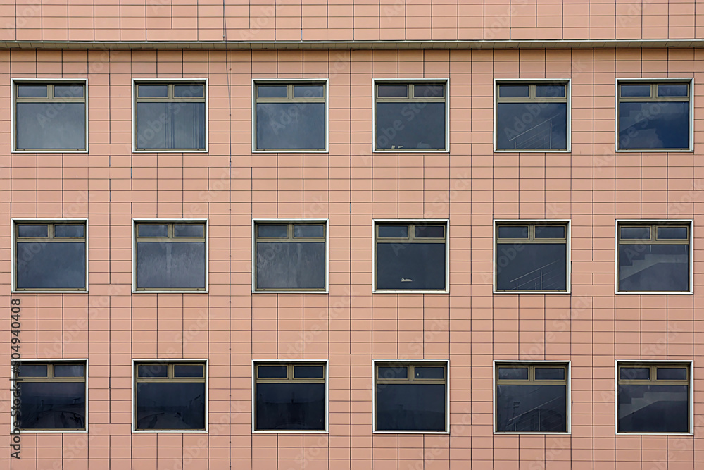 A fragment of the building facade with windows A fragment of the building facade with windows
