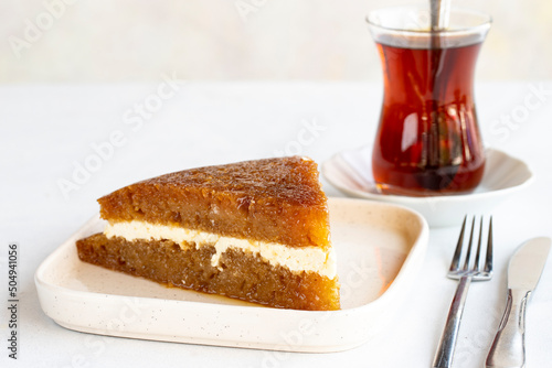 Bread kadayif on a white background. Bread kadayif stuffed with cream in the middle. Traditional Turkish cuisine delicacies. close up. Local name ekmek kadayifi photo