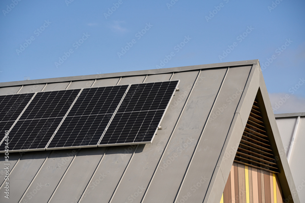 Fototapeta premium State-of-the-art solar panels placed on the roofs of houses of ecological construction