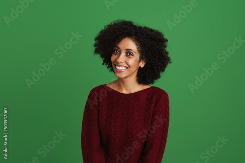 Black young woman wearing sweater smiling and looking at camera