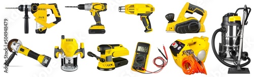 Set collection of yellow electric power hand diy tools like cordless drill angle grinder router heat gun sander and workshop vacuum cleaner isolated white background. industry concstruction concept photo