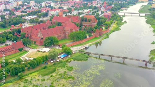 Malbork, Pomerania Poland Panoramic view of the medieval Teutonic Order Castle in Malbork, Poland - High Castle and St. Mary church photo