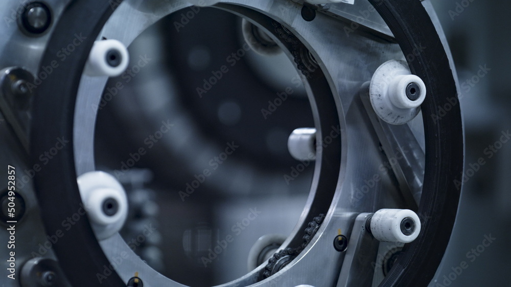 Rubber tyre tape machine working at technological automated manufacture close up Rubber tyre tape machine working at technological automated manufacture close up