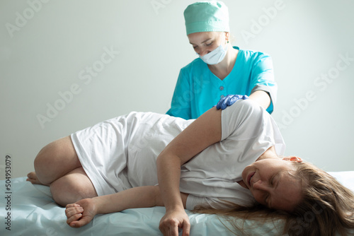 Doctor process epidural nerve block for pregnant woman photo