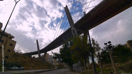 Wallpaper Mural travelling frontal tracking from a car we see the streets of Amanecer Jordan during a sunny day as the wide angle shot and we perceive different parts of the city huge bridges, traffic, buildings Torontodigital.ca