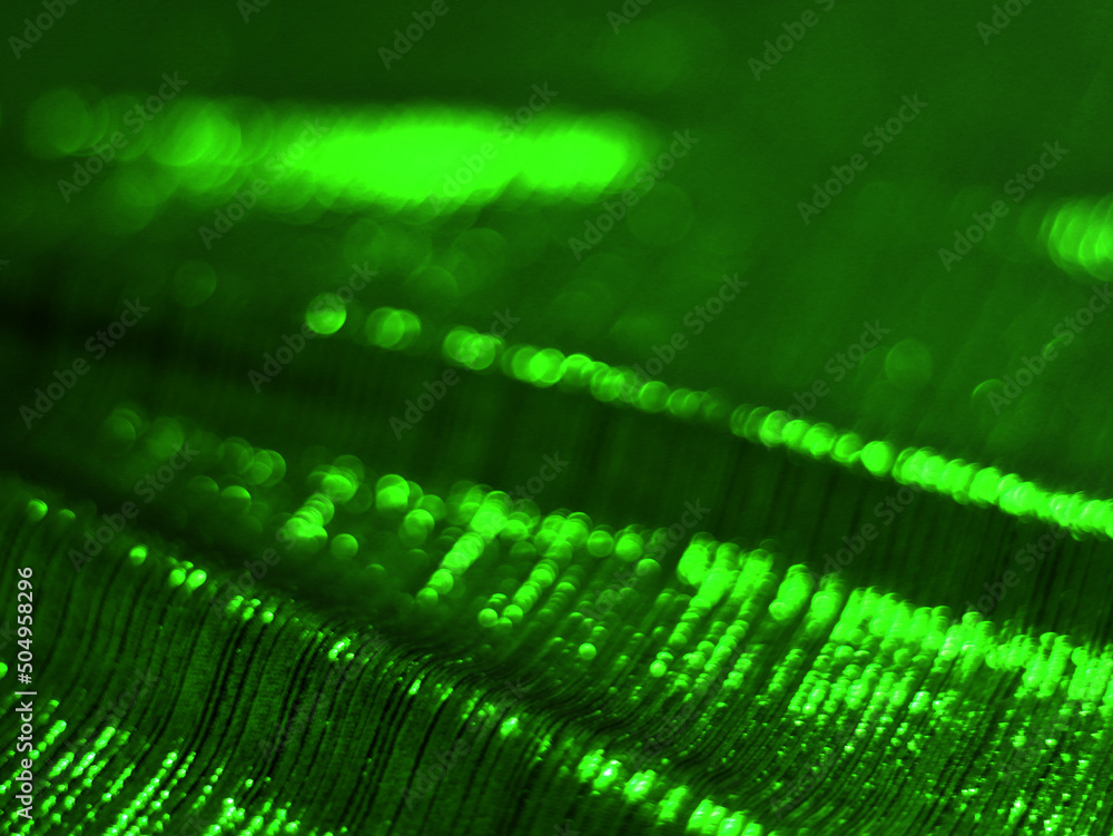 green bokeh velvet fabric texture used as background. Empty green fabric background of soft and smooth textile material. There is space for text..