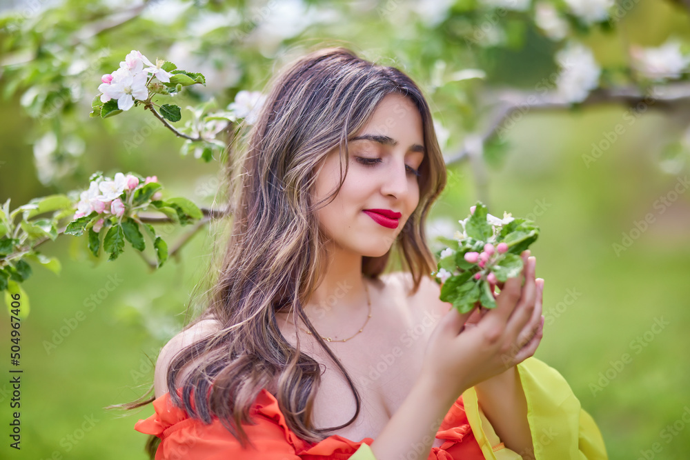 portrait of a woman in a dress in nature on a beautiful spring day portrait of a woman in a dress in nature on a beautiful spring day