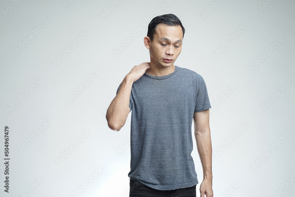 handsome asian man with fatigue gesture on isolated studio background handsome asian man with fatigue gesture on isolated studio background
