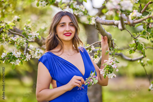 portrait of a woman in a dress in nature on a beautiful spring day
