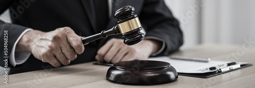 Wallpaper Mural Judge or a lawyer works documents in the courtroom and analyze the various laws for justice and accuracy, Litigation and justice concept. Torontodigital.ca