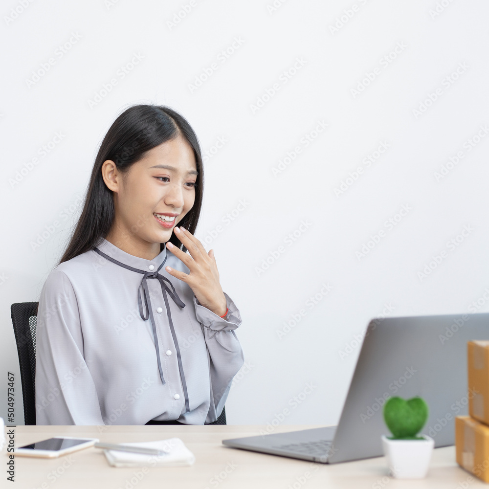 Young woman was happy after receiving an order from an internet customer, Entrepreneurs selling products online or doing freelance work at home concept. Young woman was happy after receiving an order from an internet customer, Entrepreneurs selling products online or doing freelance work at home concept.