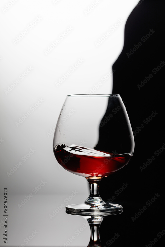 Splash of brandy in a snifter glass.