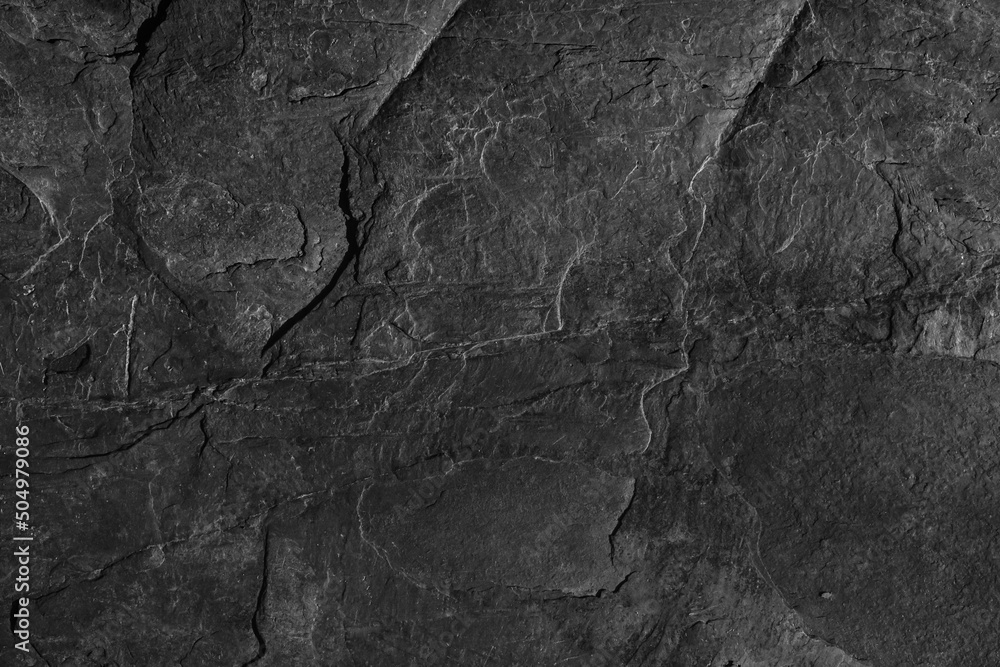 Dark grey black slate background or texture. Black granite slabs background. Dark grey black slate background or texture. Black granite slabs background.