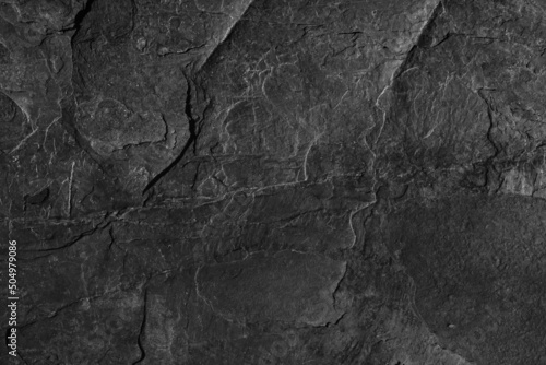 Dark grey black slate background or texture. Black granite slabs background. 