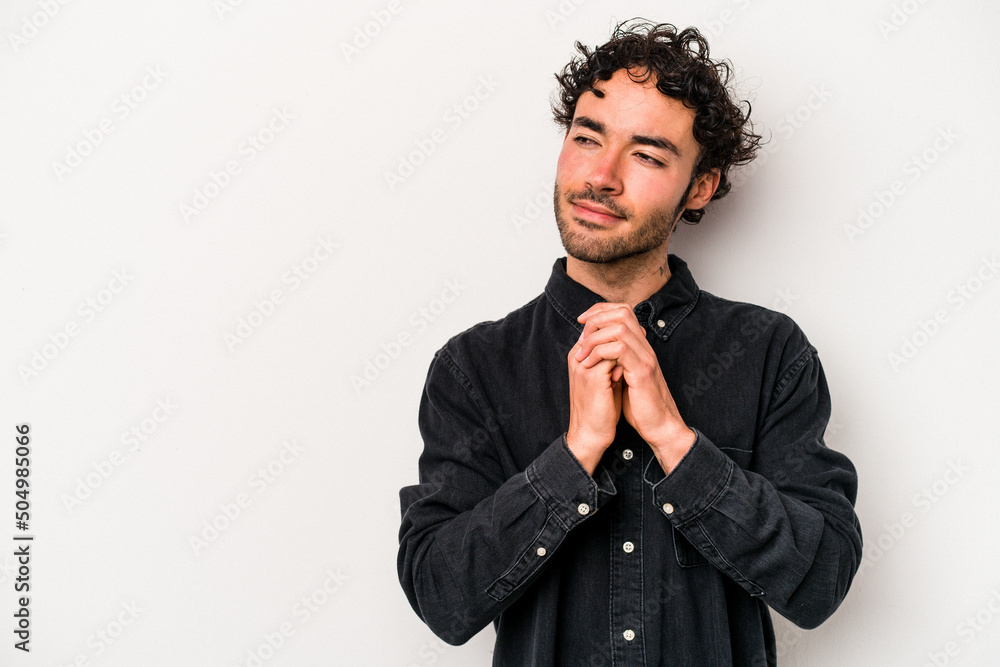 Young caucasian man isolated on white background making up plan in mind, setting up an idea. Young caucasian man isolated on white background making up plan in mind, setting up an idea.