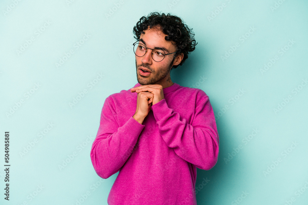 Young caucasian man isolated on white background praying for luck, amazed and opening mouth looking to front. Young caucasian man isolated on white background praying for luck, amazed and opening mouth looking to front.