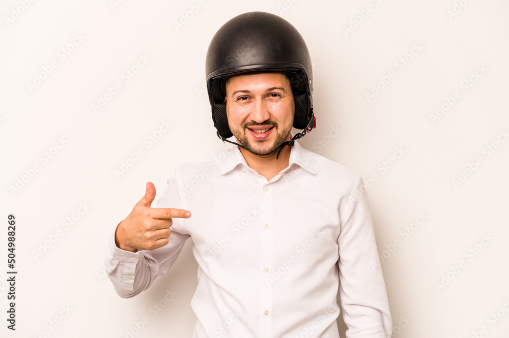 Hispanic business man going to work with motorcycle isolated on white background person pointing by hand to a shirt copy space, proud and confident Hispanic business man going to work with motorcycle isolated on white background person pointing by hand to a shirt copy space, proud and confident