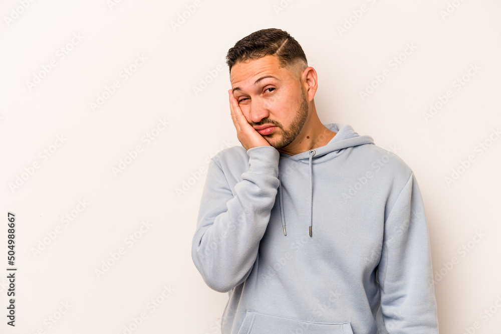 Young hispanic man isolated on white background who feels sad and pensive, looking at copy space. Young hispanic man isolated on white background who feels sad and pensive, looking at copy space.