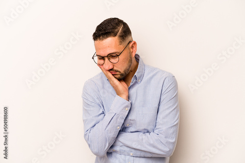 Young hispanic man isolated on white background who is bored, fatigued and need a relax day.
