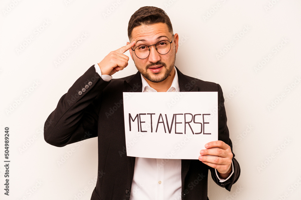 Hispanic business man holding a metaverse placard isolated on white background Hispanic business man holding a metaverse placard isolated on white background