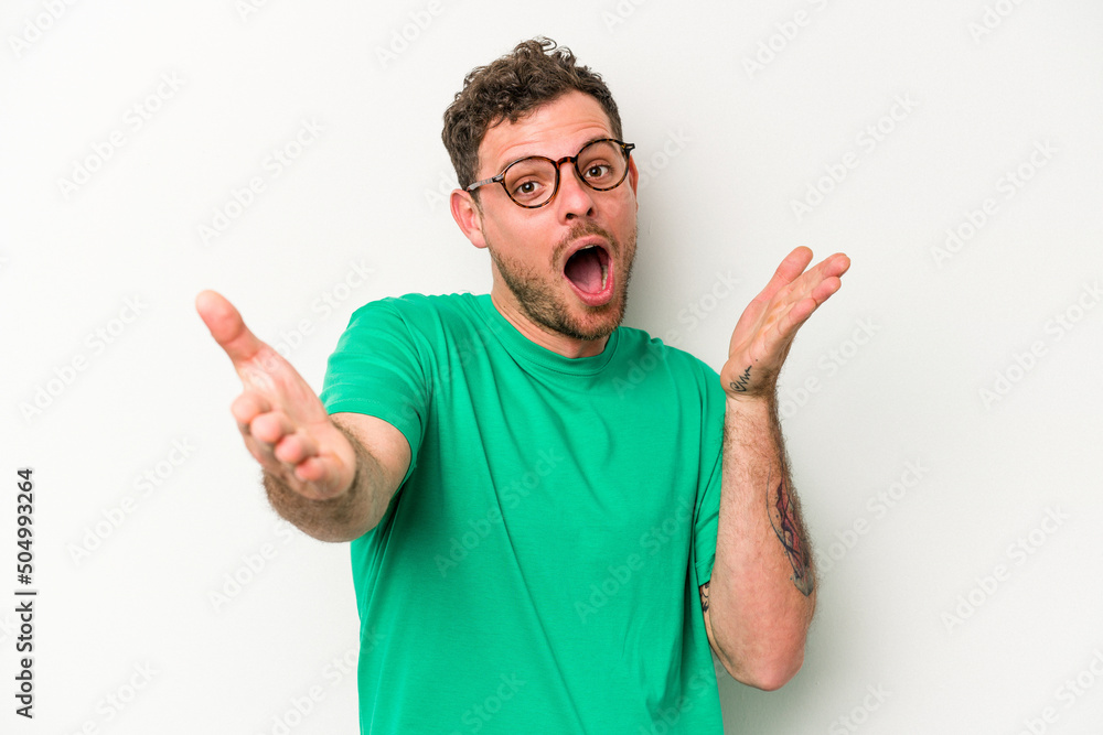Young caucasian man isolated on white background feels confident giving a hug to the camera. Young caucasian man isolated on white background feels confident giving a hug to the camera.