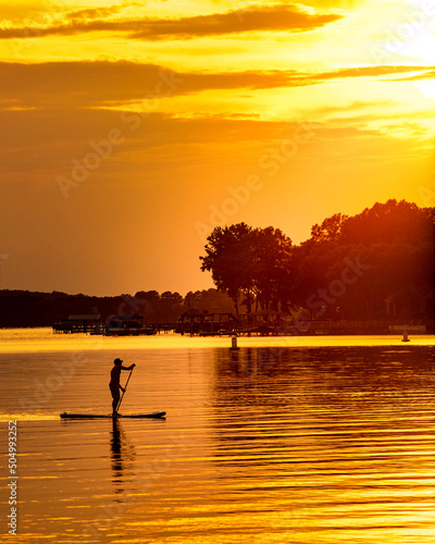 Paddle boarding in golden light on Lake Norman, NC © Jon